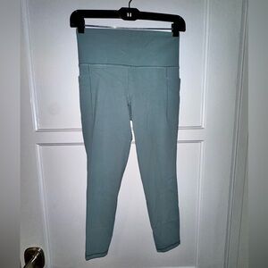 Athleta Salutation Stash Pocket II 7/8 Tight in sage green size Small S